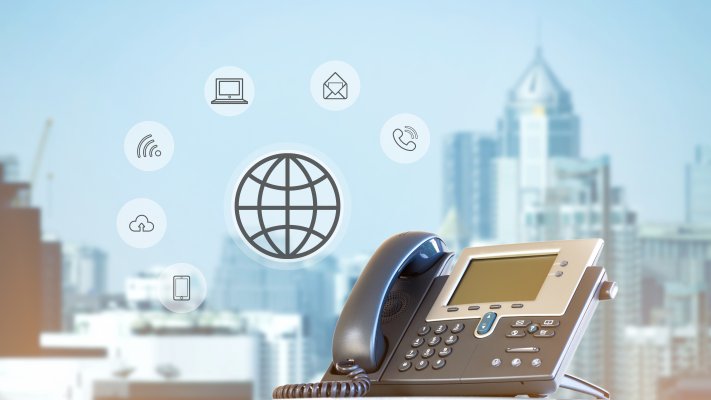 cost price voip service phonepower voip phone city in the background wireless cloud phone call computer icons symbols